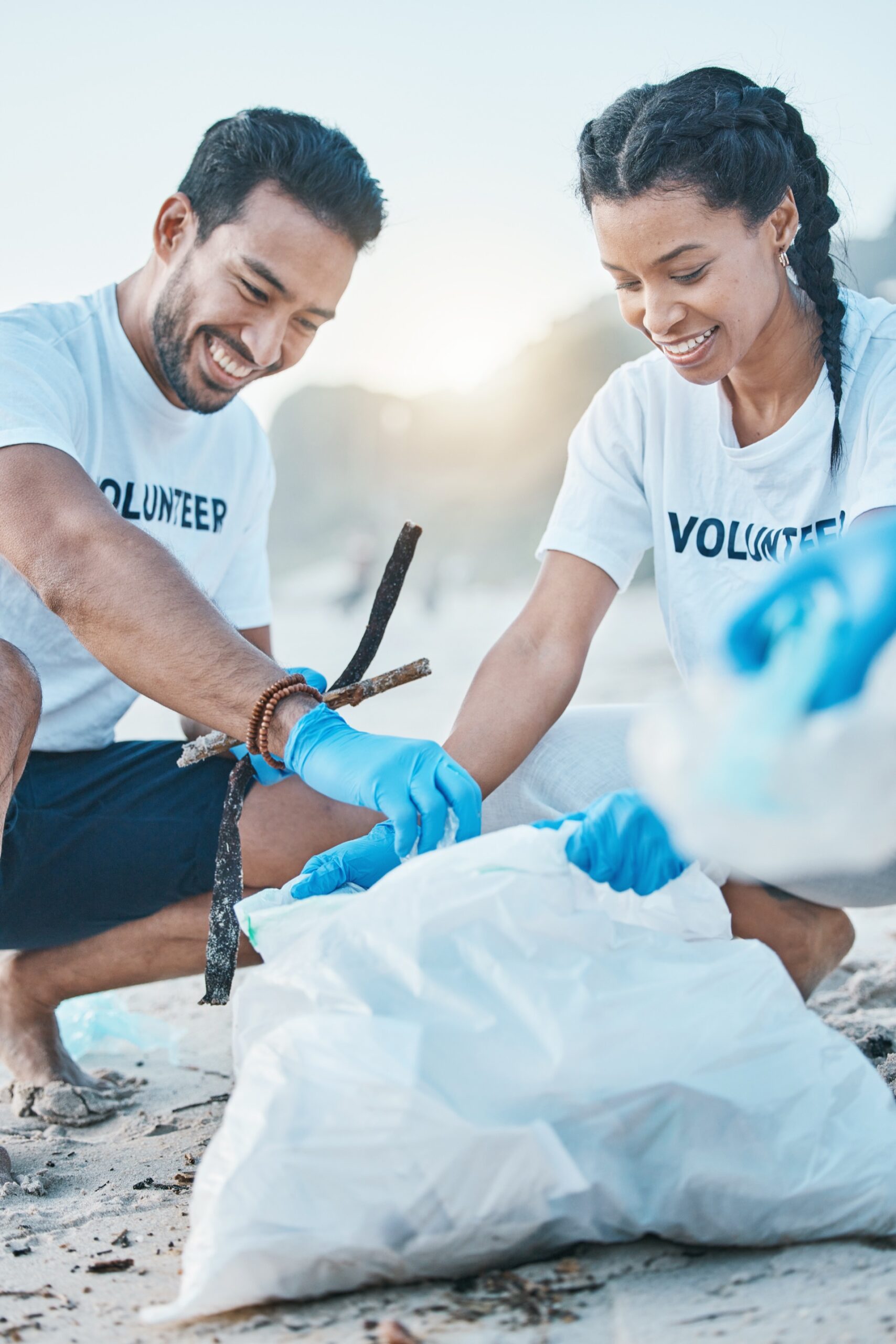 Volunteers cleaning a beach together